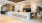  A reception area with a white reception desk and the words 