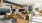  A large room with wooden floors and furniture.