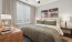  A bedroom with a large bed and a ceiling fan.