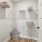  A white closet with shelves and baskets.