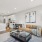  A modern living room with a glass coffee table and a couch.