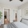 Bedroom with attached bathroom and a plant
