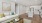 Living room with a white couch and an attached kitchen