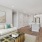 Living room with a white couch and an attached kitchen
