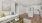 Living room with a white couch and an attached kitchen